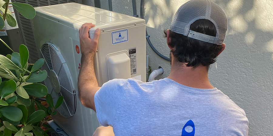 Rocket Cooling technician installing ductless unit