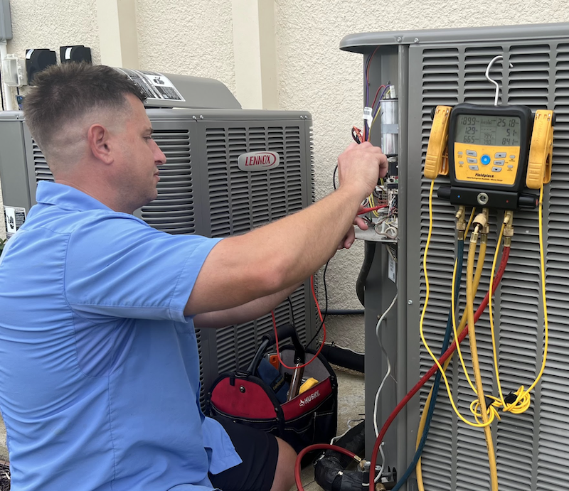 technician working on an ac unit